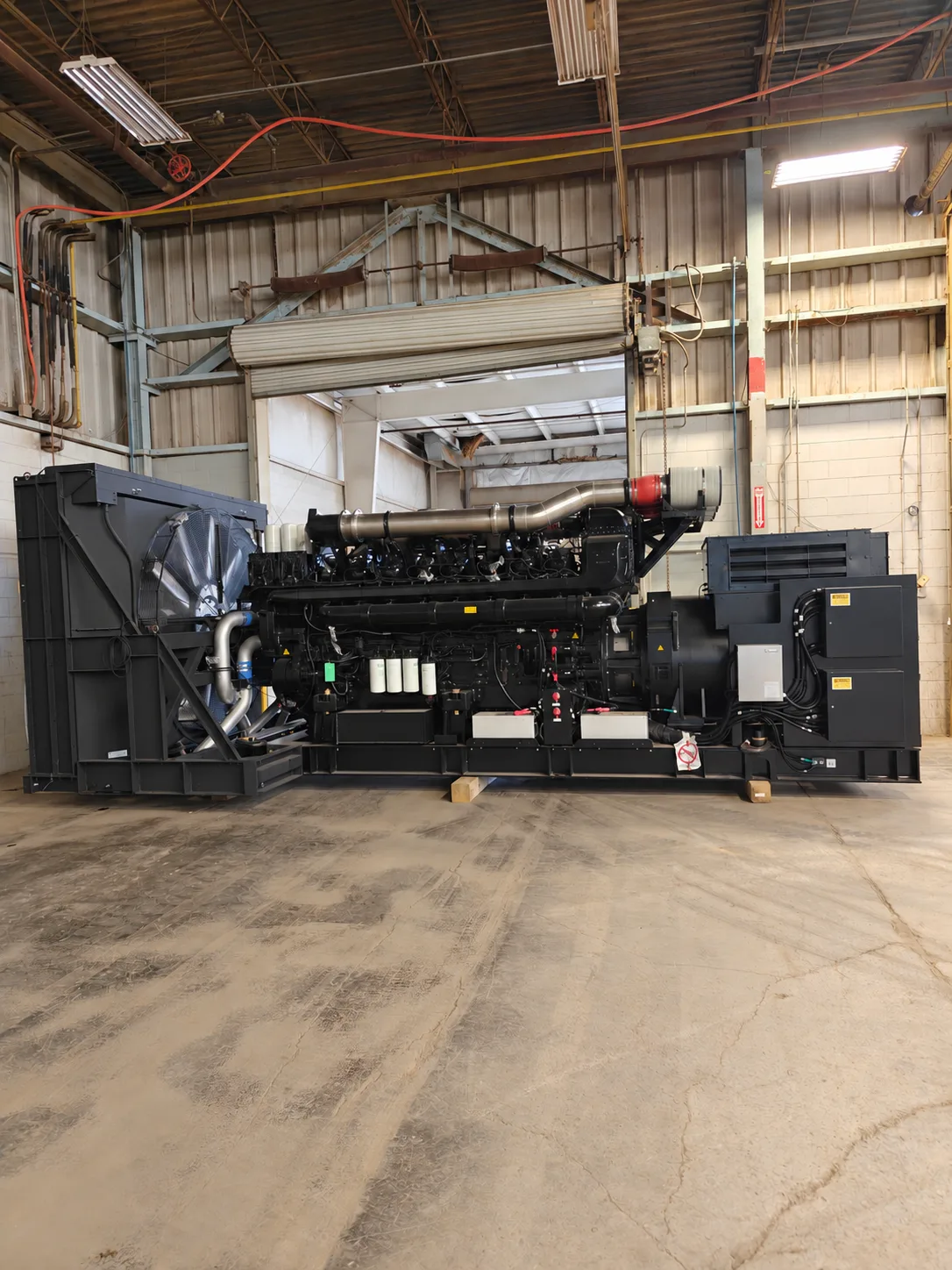 Industrial generator staged inside a warehouse